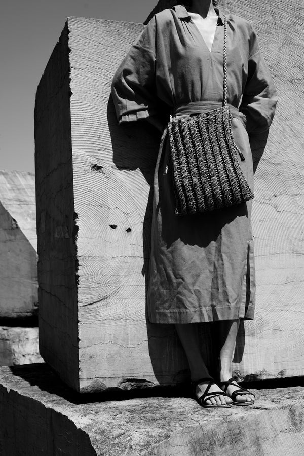 Standing Women with a INES bag